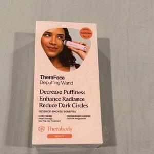 Therabody TheraFace Wand in White and Orange